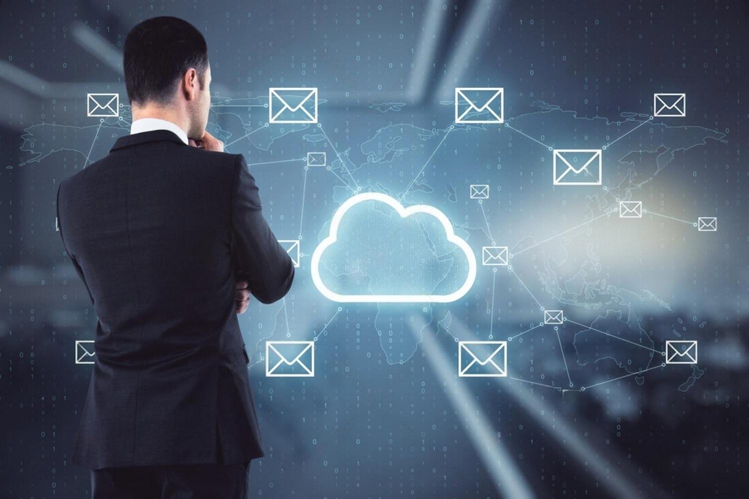 Businessman in Dubai office looking at cloud and email network illustration